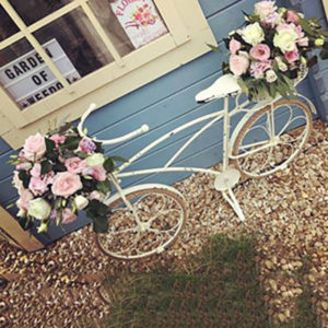 Cream Bike with 2 Floral Arrangements
